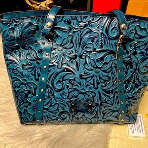 Patricia Nash leather bag with scrolling.12x13 with 12” straps. Some wear.